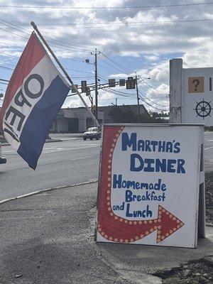 The sign by the highway.