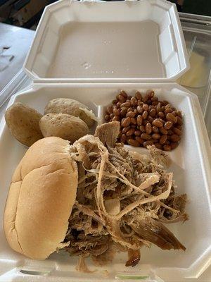 Pulled pork dinner with baked beans and salt potatoes