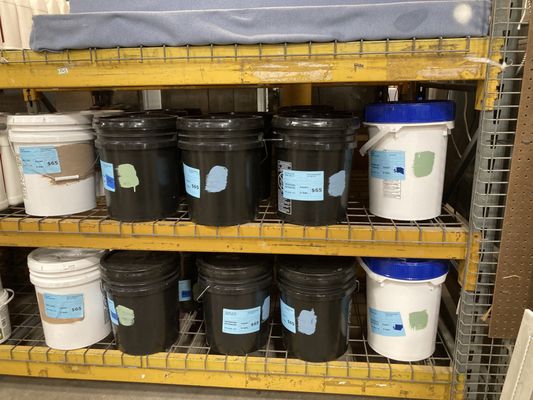 Colored 5 gallon buckets of paint