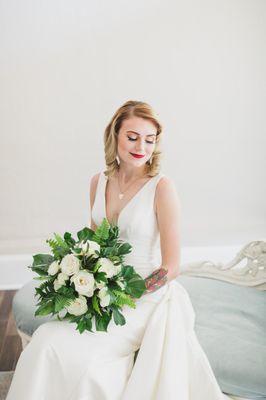 Bridal portrait on couch at White Room bridal suite