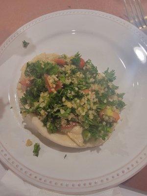 Pita layered with hummus and tabbouleh.