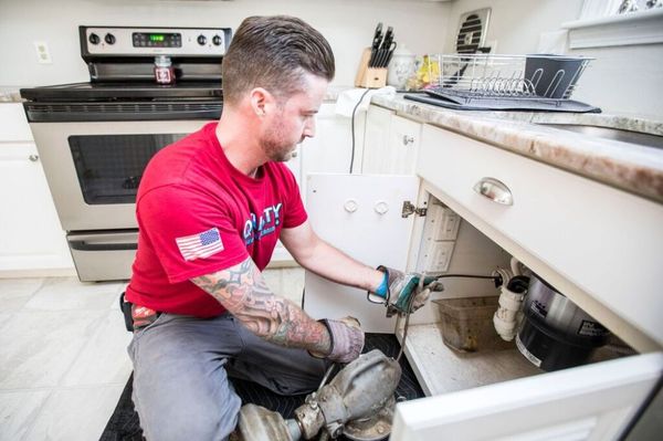 Clearing a kitchen drain stoppage