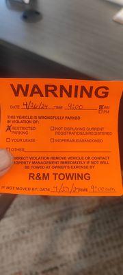 Orange parking violation stickers