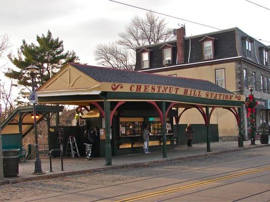 Daytime pic of Chestnut Hill News Stand. Grab a paper before your train ride.