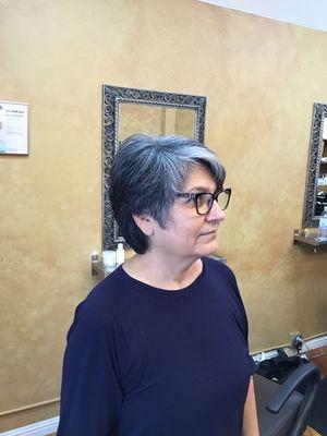 Short haircut that cut for her shape face. And keeping it very feminine.