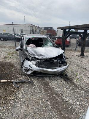 Rollover car crash caused by texting and driving.