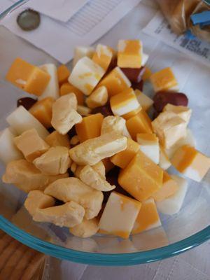 All Wisconsin Cheese curds, cheddar cheese, string cheese, Colby jack cheese, and mini beef sticks