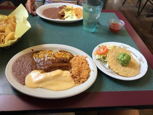 Garcia's Mexican Dinner: cheese enchilada; two tamales with chili gravy; refried beans and rice. Beef taco and guacamole tostada.