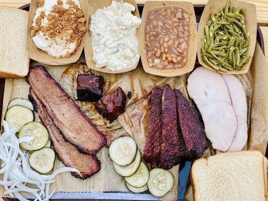 Brisket, bacon burnt ends, ribs, and turkey. Yum, yum, yum, and yum. Key lime crumble, potato salad, baked beans, green beans.