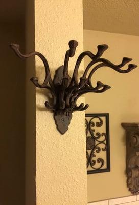 Unique cast iron hooks, this is an example of a happy customer showing off what they used it for