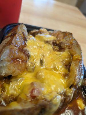 Chili Cheese Baked Potato. Not quite what the pictures depict, but decent and likely healthier than burgers and fries.