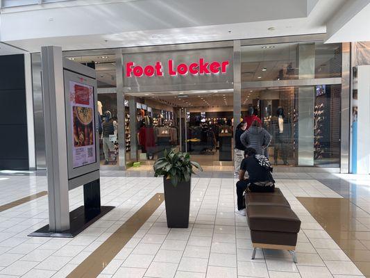 FOOTLOCKER worker and potential customers waiting for the MANAGER of the FOOTLOCKER to open @11:31am