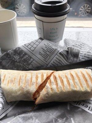 Breakfast burrito with sausage, egg, cheese and salsa. Grilled in a panini press. Very tasty!