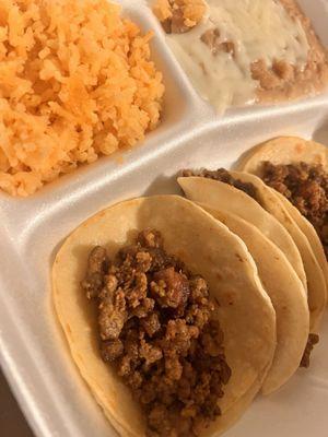 Plain 3 asada tacos plate with rice and beans.