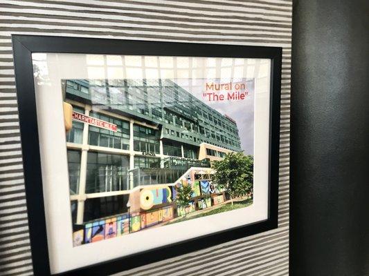 The 'Our Baltimore' Mural Art framed on The "Charm'tastic Mile" in lobby of Renaissance Harborplace Hotel.