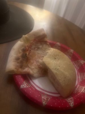 Pizza and bread, reminds me of the pizza from Chuck E. Cheese's.