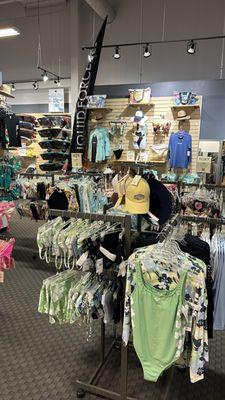 Women's swim suit cover ups, rash guards, board shorts, wakeboards at Sun & Ski Sports.