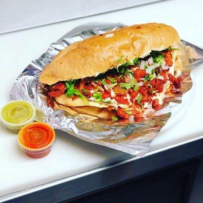 Customer's favorite!  Torta al pastor with a cheesy finish!