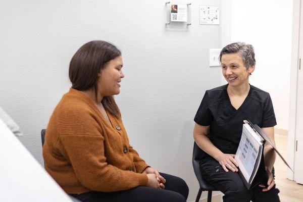 A patient receiving medical information about all her pregnancy options.