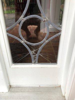 Broken leaded glass in the right corner