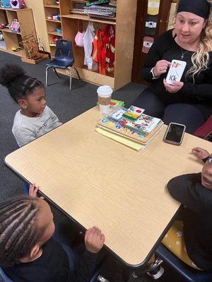 Learning to recognize the letters of the alphabet.