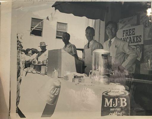 (1st right to left) My grandfather Ed Williams. He is flipping pancakes at the Grand Opening of Williams Bros. Markets in 1950