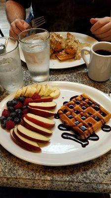 Brunch! Chicken and waffles with gravy added and a Belgian waffle with chocolate sauce