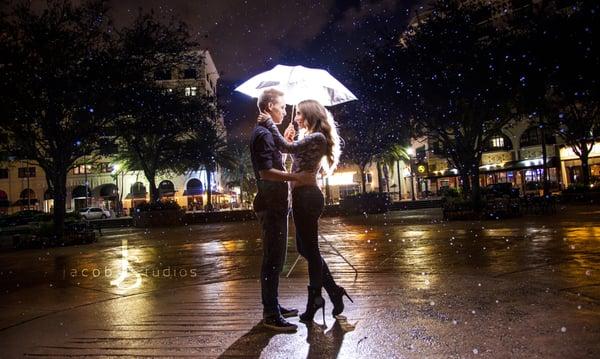 Engagement shot taken on location in downtown West Palm Beach, started raining just in time for this shot.