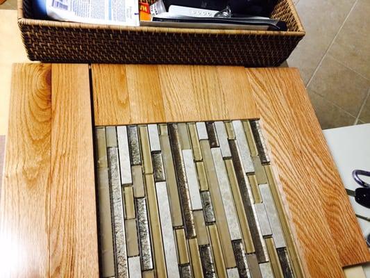 Table made from the remnants of the wood flooring & glass tile.