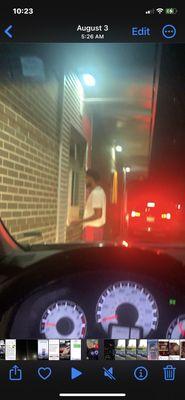 Customer getting served walking in the drive thru wth