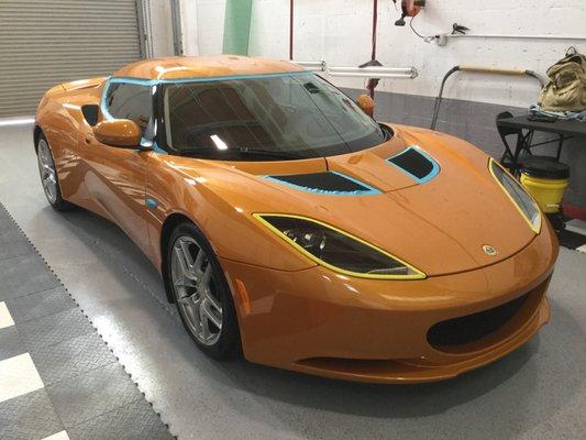 Lotus Evora receiving some paint correction before getting a full Xpel Ultimate wrap.