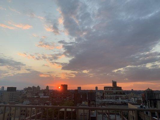 sunset over the hudson from the rooftop