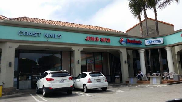 In a small strip mall, next to a nail place, Domino's Cold Stone and Chase.