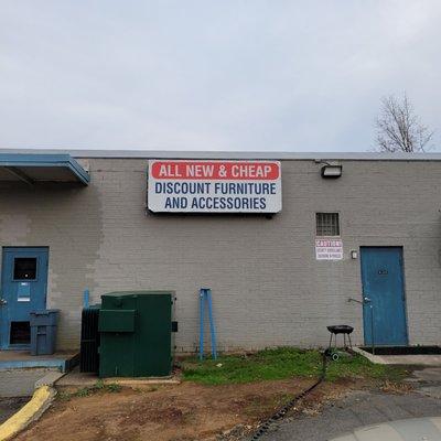 Big sign on front of warehouse