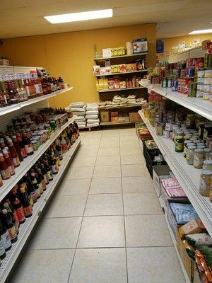 On the left, bottled flavorings and sauces. I personally love patis and banana sauce. On the right, canned and jarred goods.