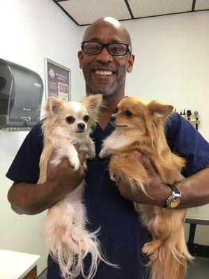 Head Technician Reggie enjoying some cuddles with these cute pups.