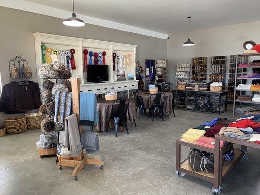 Have a seat and watch the alpacas who graze right outside the store windows