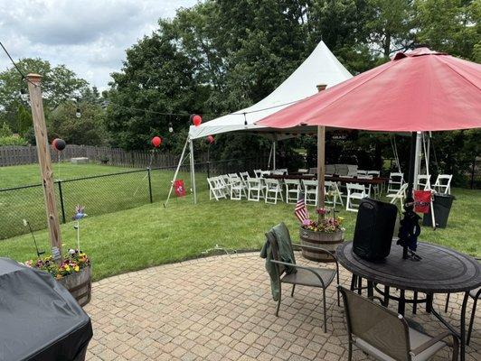 We set up the tables and chairs how we wanted them. The tent kept them dry for the day early they came and it poured!