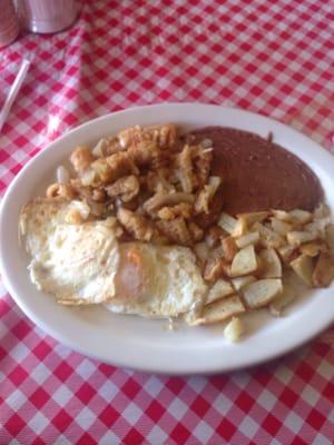 Chicharrones in salsa plate w/two eggs. Yum!