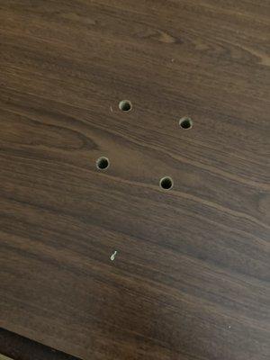 Holes through one of the tables in the room