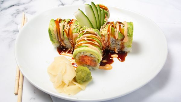 Rock and Roll: spicy tuna with tempura flake inside top with slice fresh avocado and eel sauce