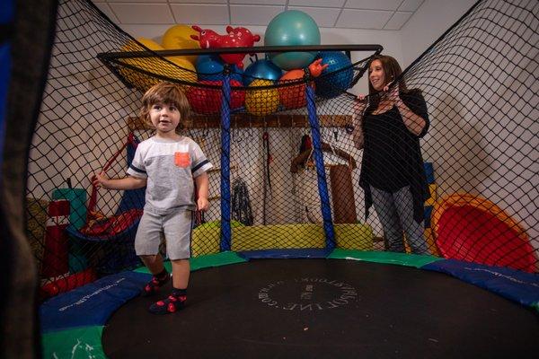 Testing out the vestibular and proprioceptive input that a trampoline provides.