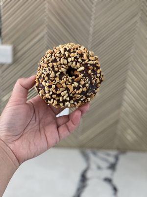 Chocolate cake donut with peanuts