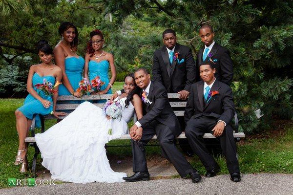 bride and groom poses with bridal parties