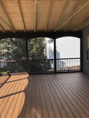 The inside of the screened in portion of the deck.