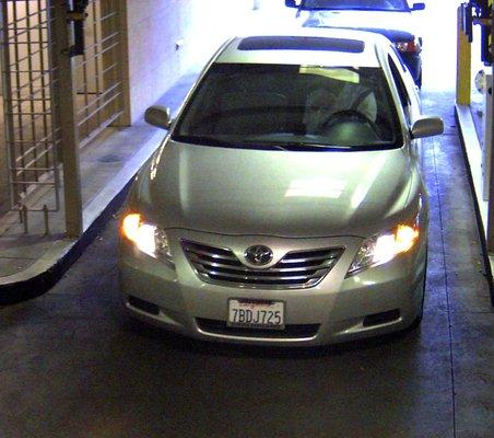 Parking garage camera installed in lower level, poorly lit garage.  Captures 100% of license plates entering.