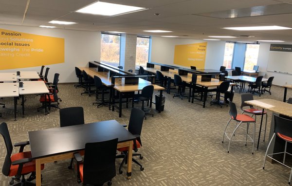 Nexus Impact Coworkng Corner with various desks that could be rented as dedicated desks.