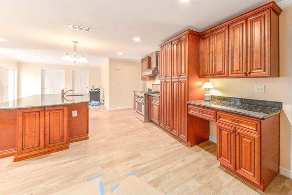 These rich cherry glaze traditional kitchen cabinets adds a classic charm to every home.