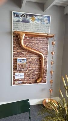 Copper gutters and rain chains.