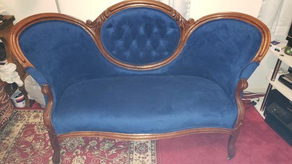 Reupholstered antique love seat